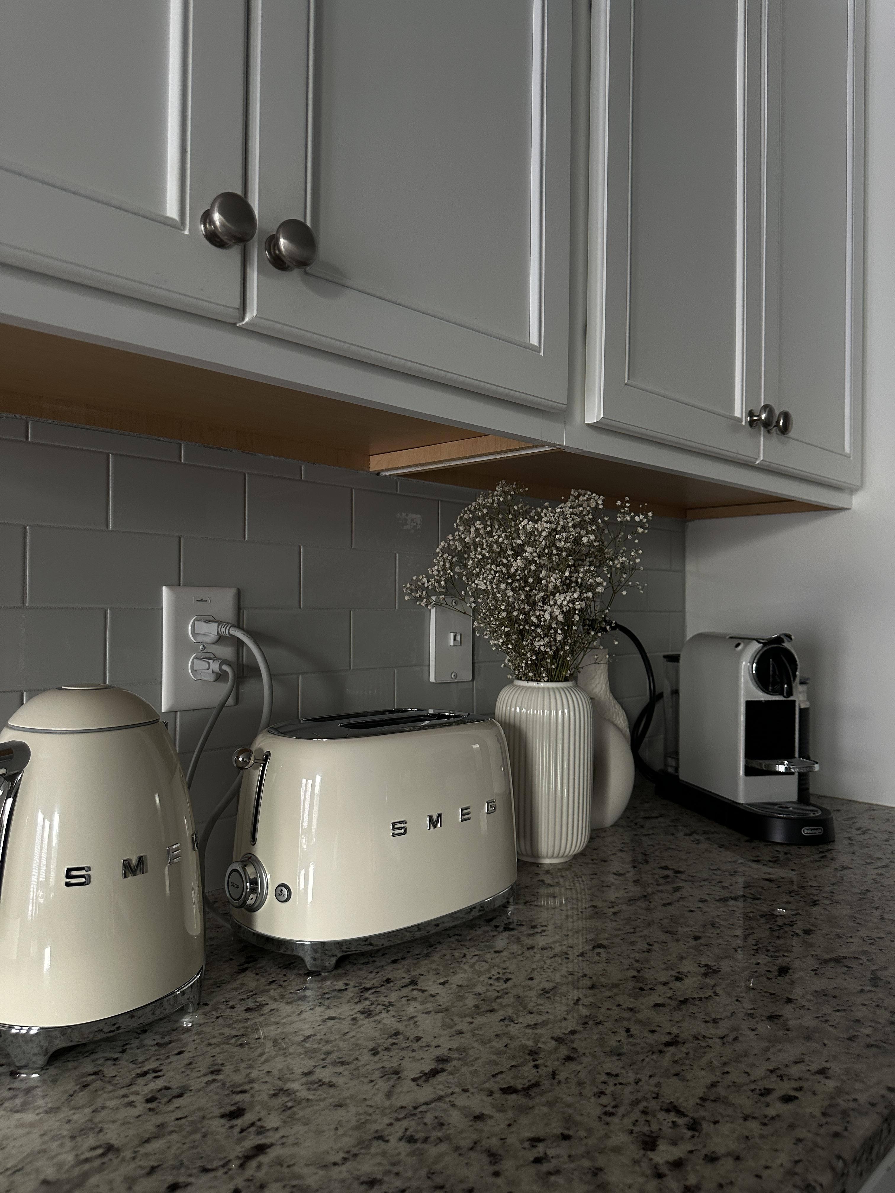 Customer photo showing a cream SMEG toaster and matching kettle
